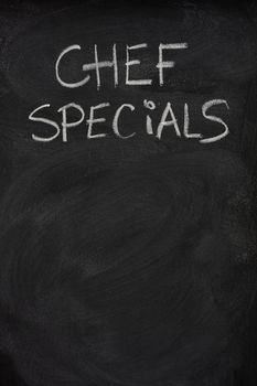 chef specials title handwritten with white chalk on blackboard, copy space below