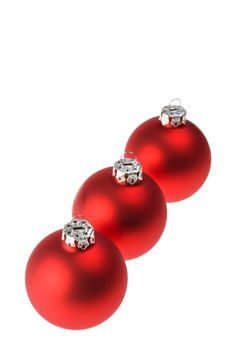 three red christmas baubles isolated on white background