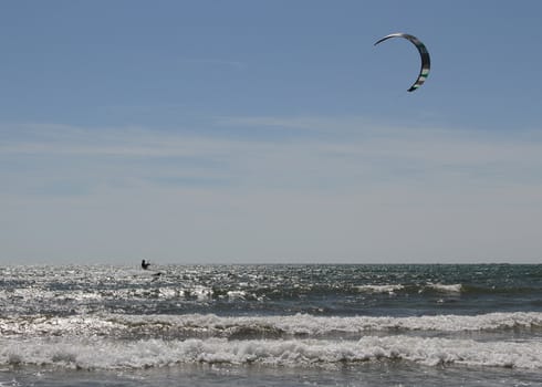 kite surfer in the distance on the sea.