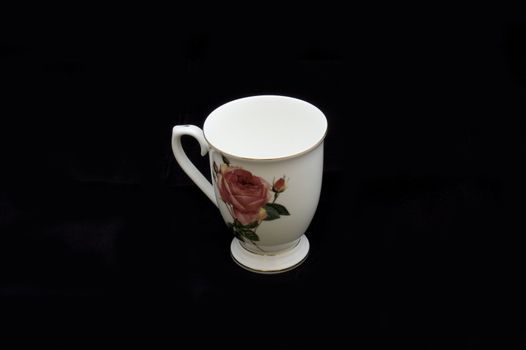 white cup isolated on black background