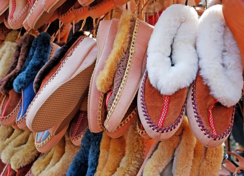 various comfortable home shoes keeping warm hanging