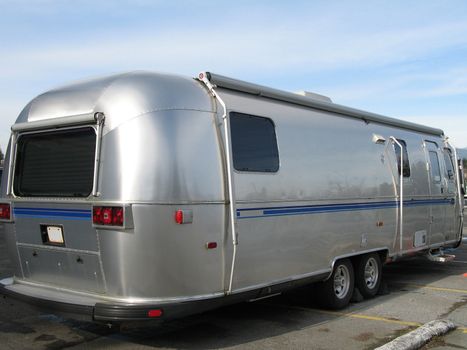 old silver and blue caravan