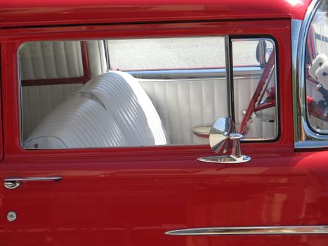 red door of an old car
