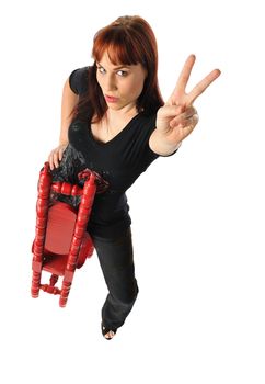 Attractive young woman in a tall back chair on a white background