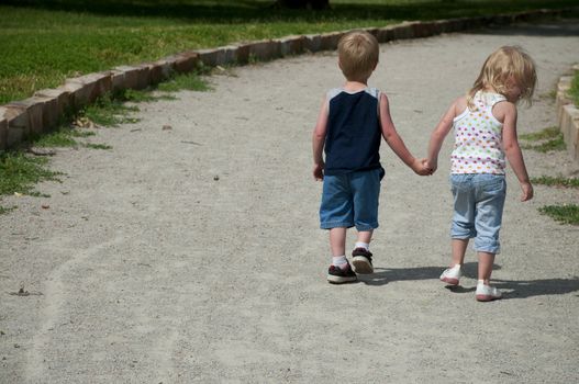 young children in the park playing and having fun