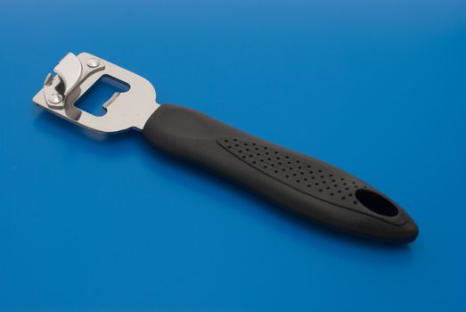 Can opener isolated on the blue background.