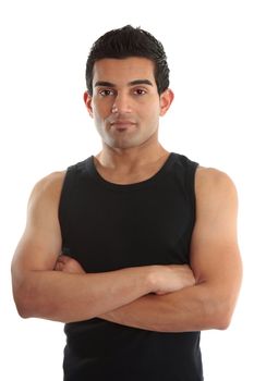 A personal trainer, fitness instructor, gymnast, tradesman or builder wearing a black tank top with arms crossed.  White background.