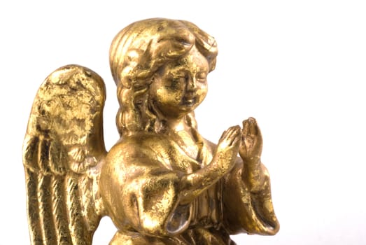 Little golden angel praying, isolated on white.