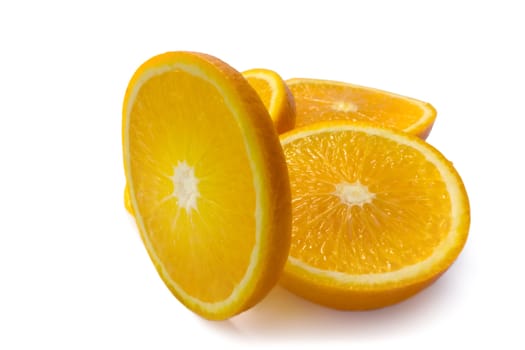 Segments of a juicy and ripe orange on a white background