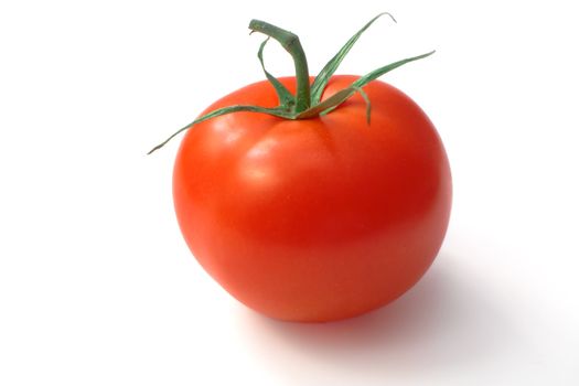 Ripe red and juicy tomato on a white background
