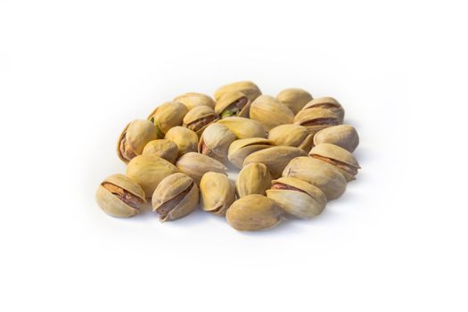 Much salty pistachioes on white background