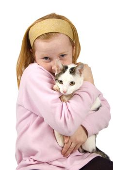 red head girl holding a white cat on white