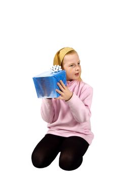 red head girl is listening to a package on white
