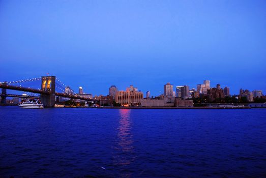 Fragment of Brooklyn Bridge in evening New York City