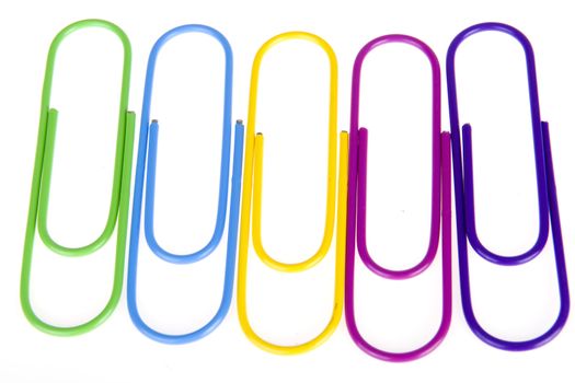 five colorful paperclips on a white background