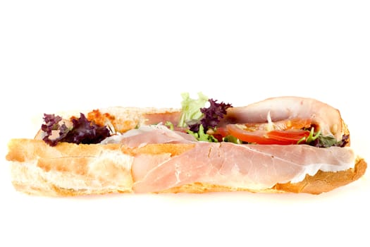 a fresh and healthy baguette with ham and vegetables