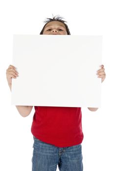 a young boy with a sign