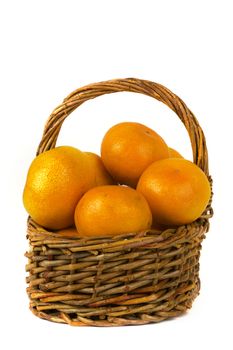 a basket full with mandarins on a white background