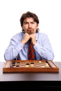 businessman playing chess over white background