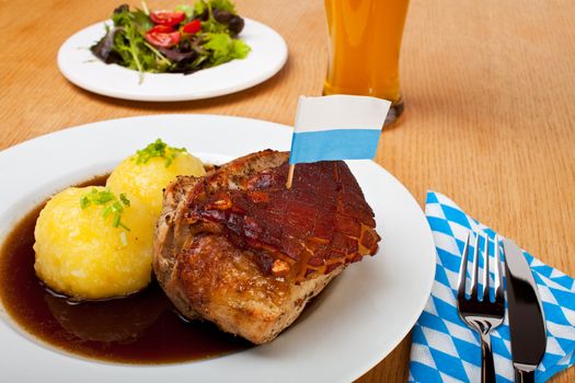 bavarian roast pork dish with potato dumplings