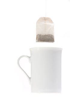 teabag and a white cup isolated on white background