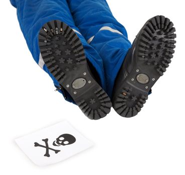 Male foots and skull on a white background