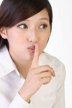 Closeup portrait of business woman with silent sign gesture on lips.