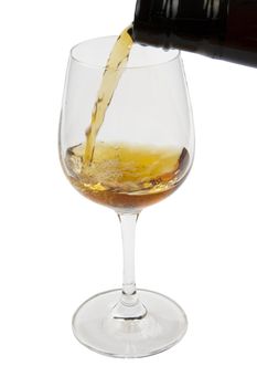 Pouring old wine into a glass, isolated on white background