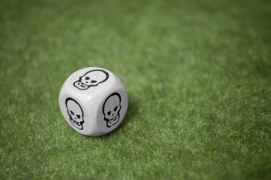 Bad luck is always here, skull dice over a green carpet