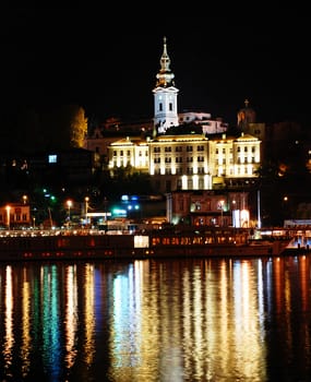night illuminated Belgrade from river with light reflection