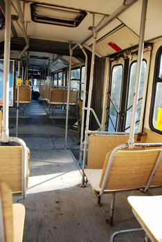 old empty city public bus interior wooden seats