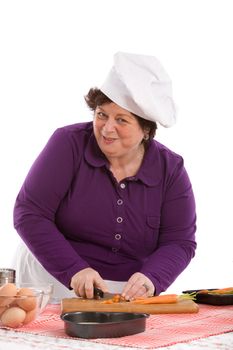 Female chef preparing the carrots in the kitchen