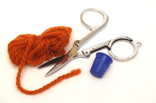 wool, scissors and thimble