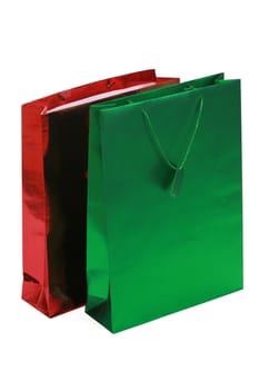 Red and green gift bags isolated on white