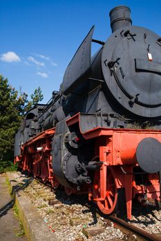 A steam locomotive standing at a station