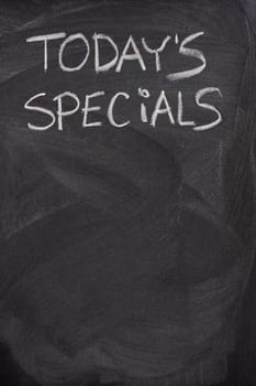 today's specials title handwritten with white chalk on blackboard, copy space below