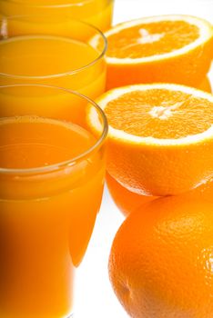 fresh and healthy orange juice ,unfiltered ,over a light table