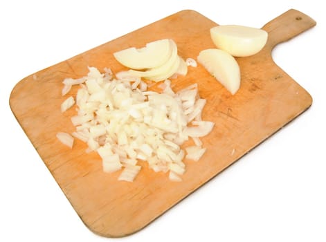 The finely cut onions lying on a kitchen board