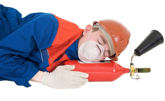 Sleeping laborer on the helmet with fire extinguisher on a white background