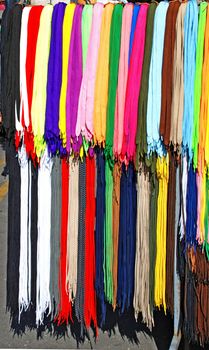 multicolored new laces hanging in row on sale