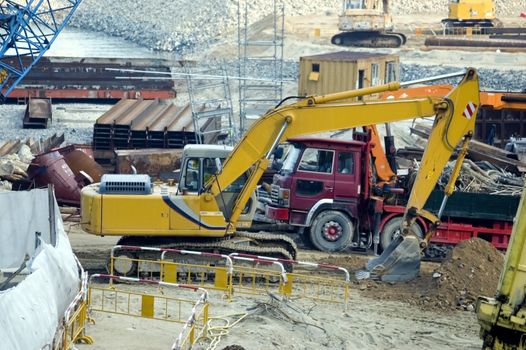 Hongkong, city center - work in progress. Tools, machines, excavators and truck.