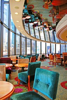 round restaurant with furniture in ceiling mirror reflection upside down