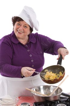 Female chef showing the inside of her frying pan with scrambled egg