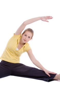 Pretty blond woman doing stretch exercises