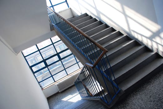 interior of public building with gray staircase