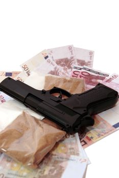 a stash of drugs gun and money showing a dangerous cost to life against a white background