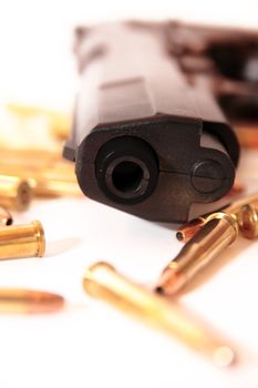 gold ammo and a handgun depicting gun culture