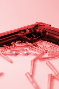 ammo and a handgun on a red background depicting gun culture