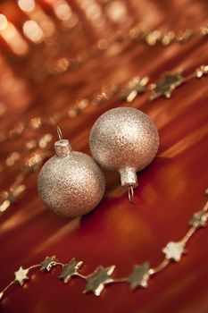 Christmas decoration with two silver baubles. Shallow depth of field, focus on bauble, aRGB.