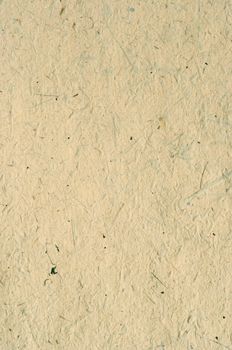 Detail of the rough surface of the handmade paper with remains of plants - natural product